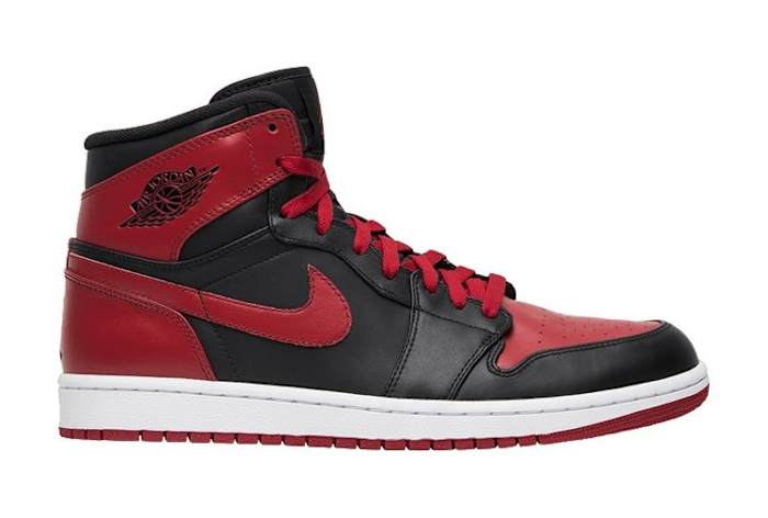 Side view of red and black Air Jordan sneakers.